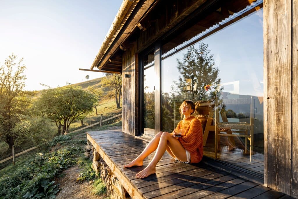 A woman basking in the sun beside a room at one of the luxury hotels in Kruger National Park