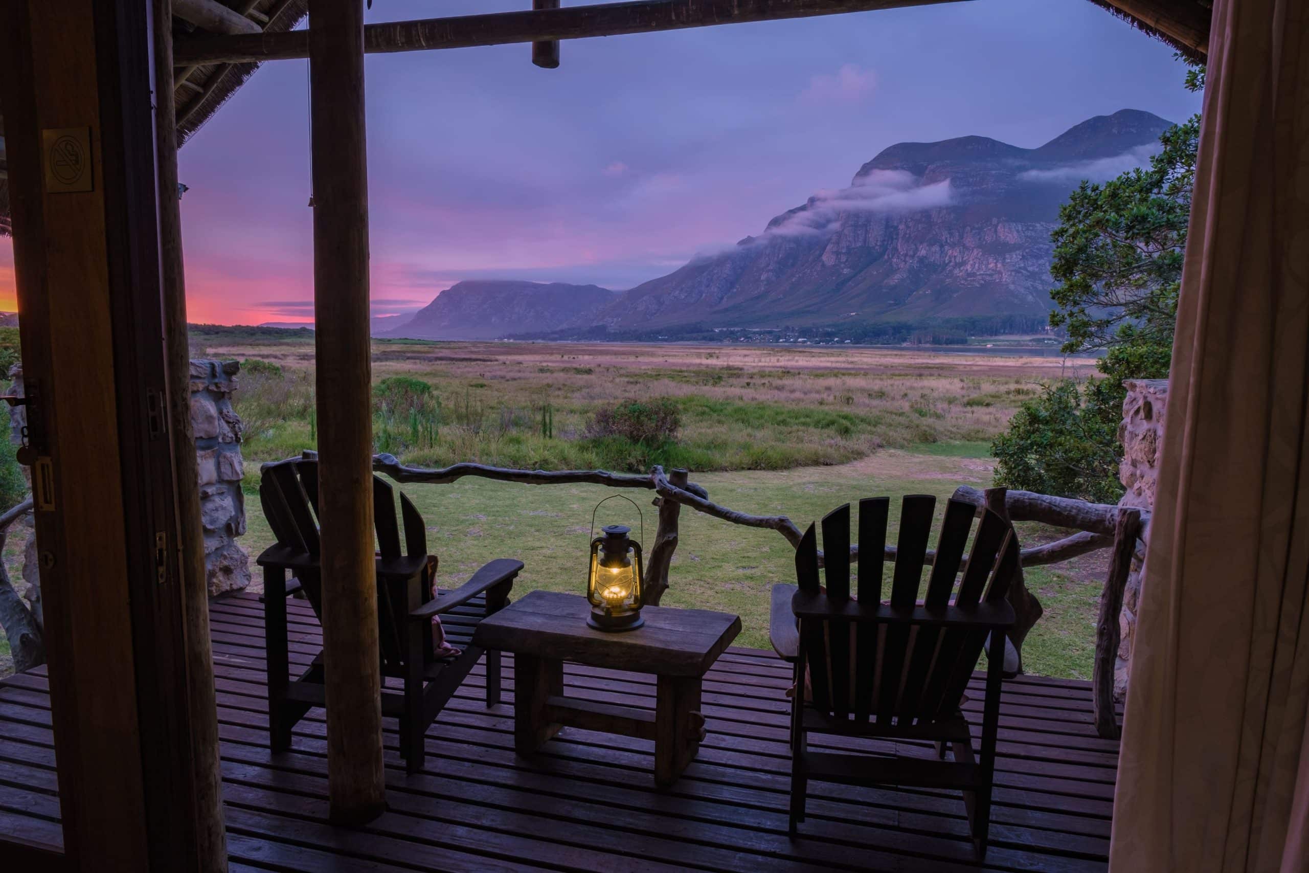 Two chairs and a lamp at one of the best Kruger lodges facing into nature