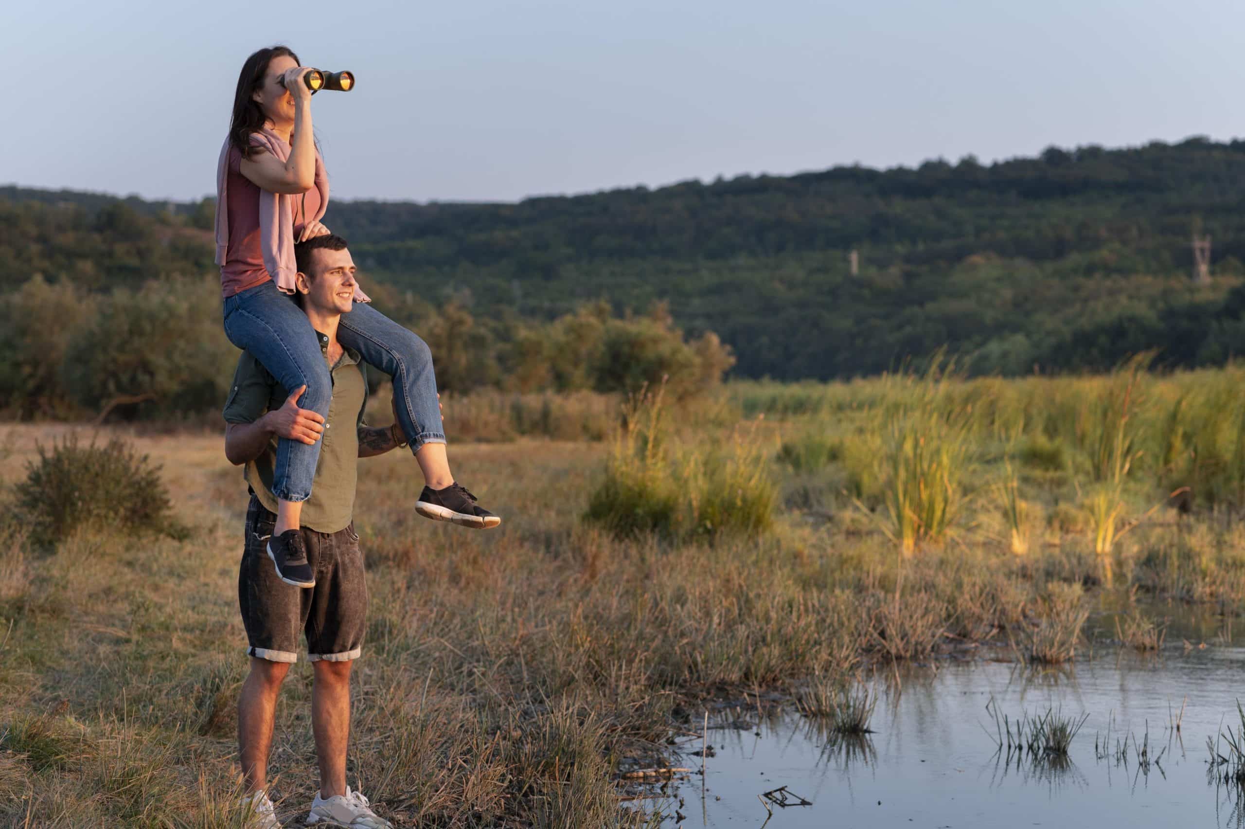 Young couple birdwatching in the Kruger in September