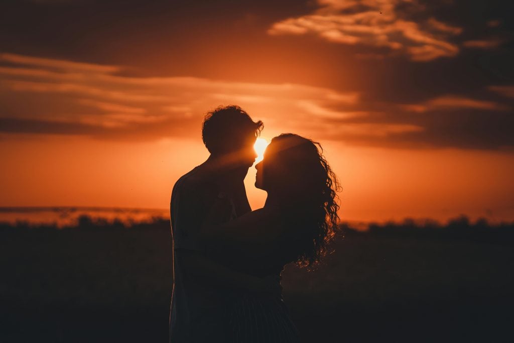 Couple embracing at sunset on a stay in the Kruger National Park