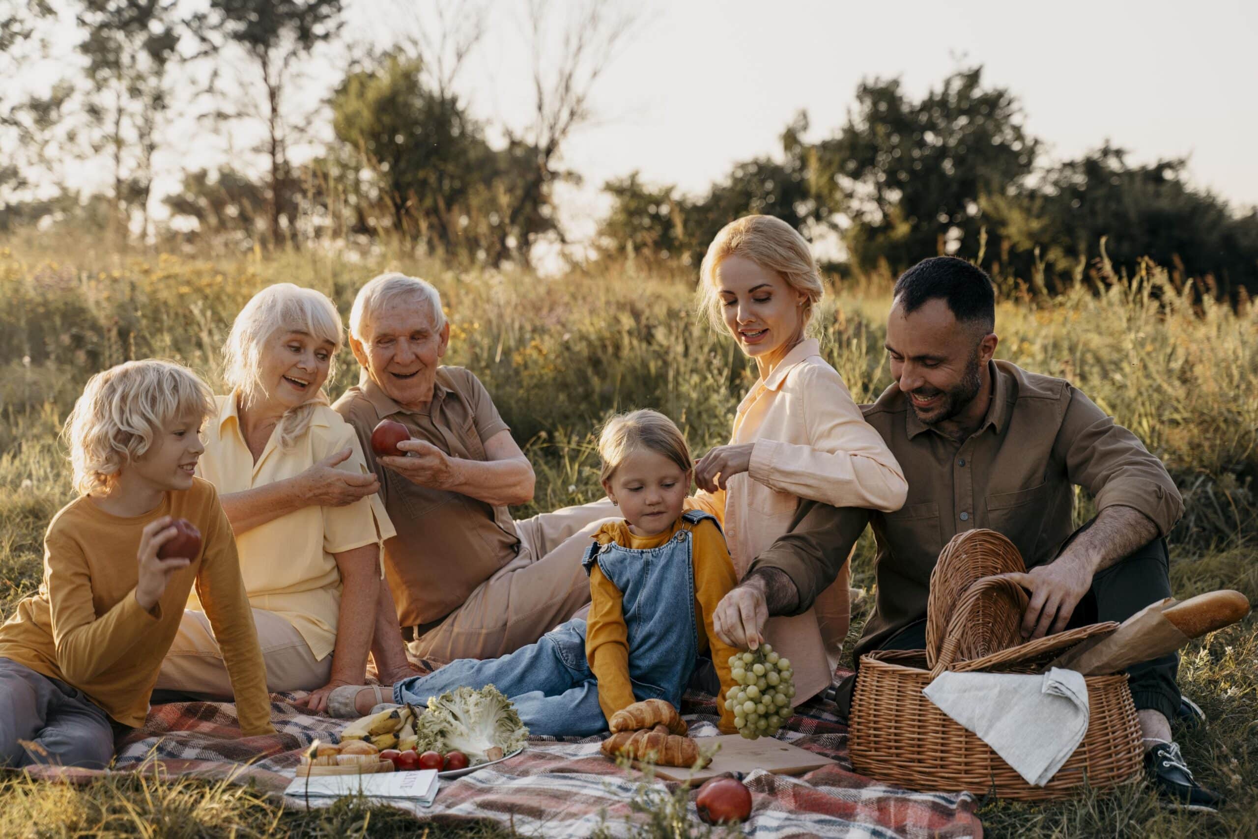 A multi-generational family having a picnic on one of their family bush getaways